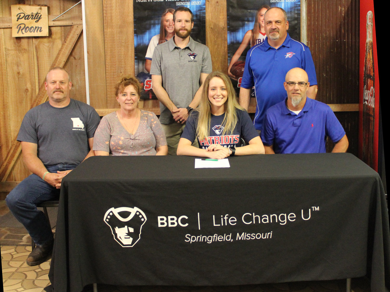 Front row, from left: Parents Chad and Cindy Sullivan, Josie Sullivan and Norwood superintendent and head girls basketball coach Shannon Crain. Back row: BBC head coach Casey Fowler and BBC assistant coach Brian Peck.